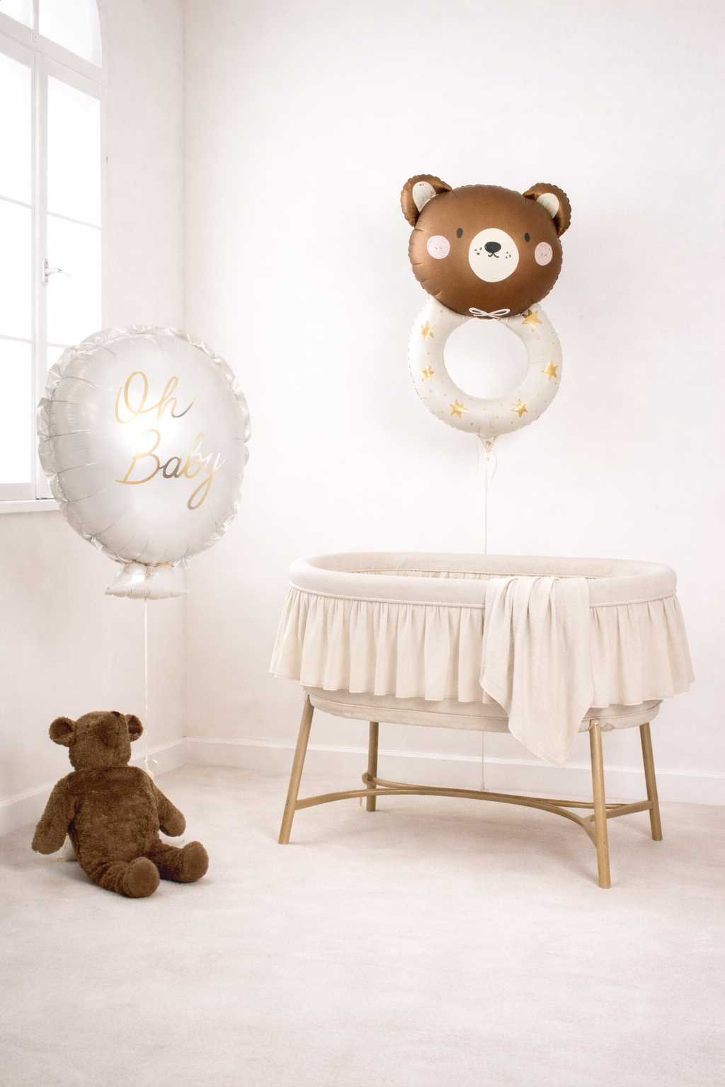 teddy bear rattle foil balloon, and oh baby foil balloons in a setting