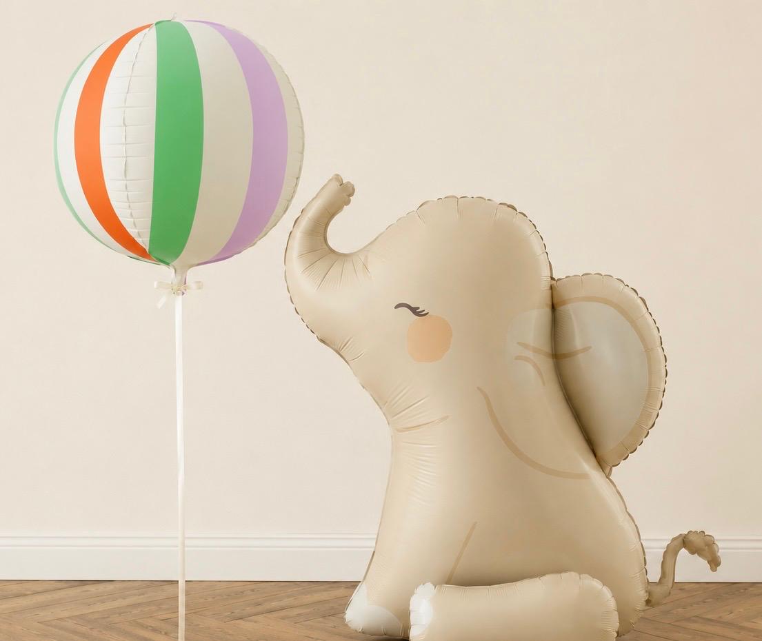 Helium striped Orbz balloon with air-filled elephant balloon for safari and jungle birthday parties, delivered inflated in Adelaide.