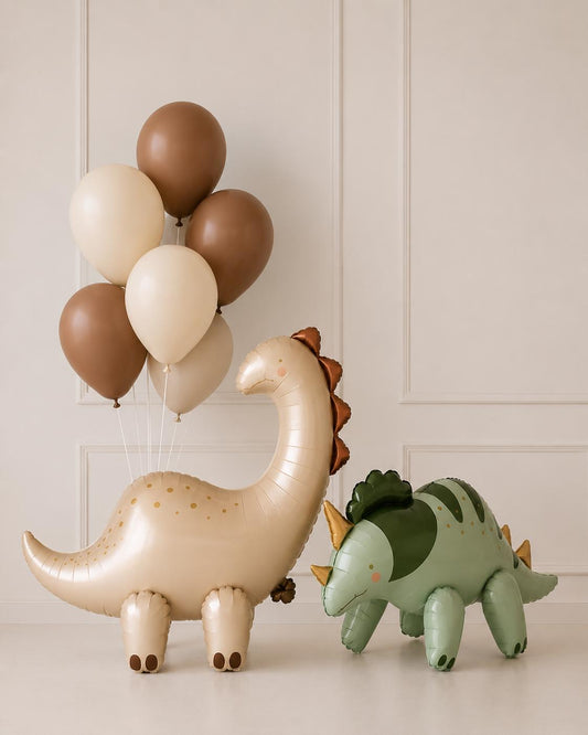 Neutral dinosaur balloon arrangement featuring a large dinosaur foil balloon paired with cocoa brown and ivory helium balloons in a minimal birthday display.