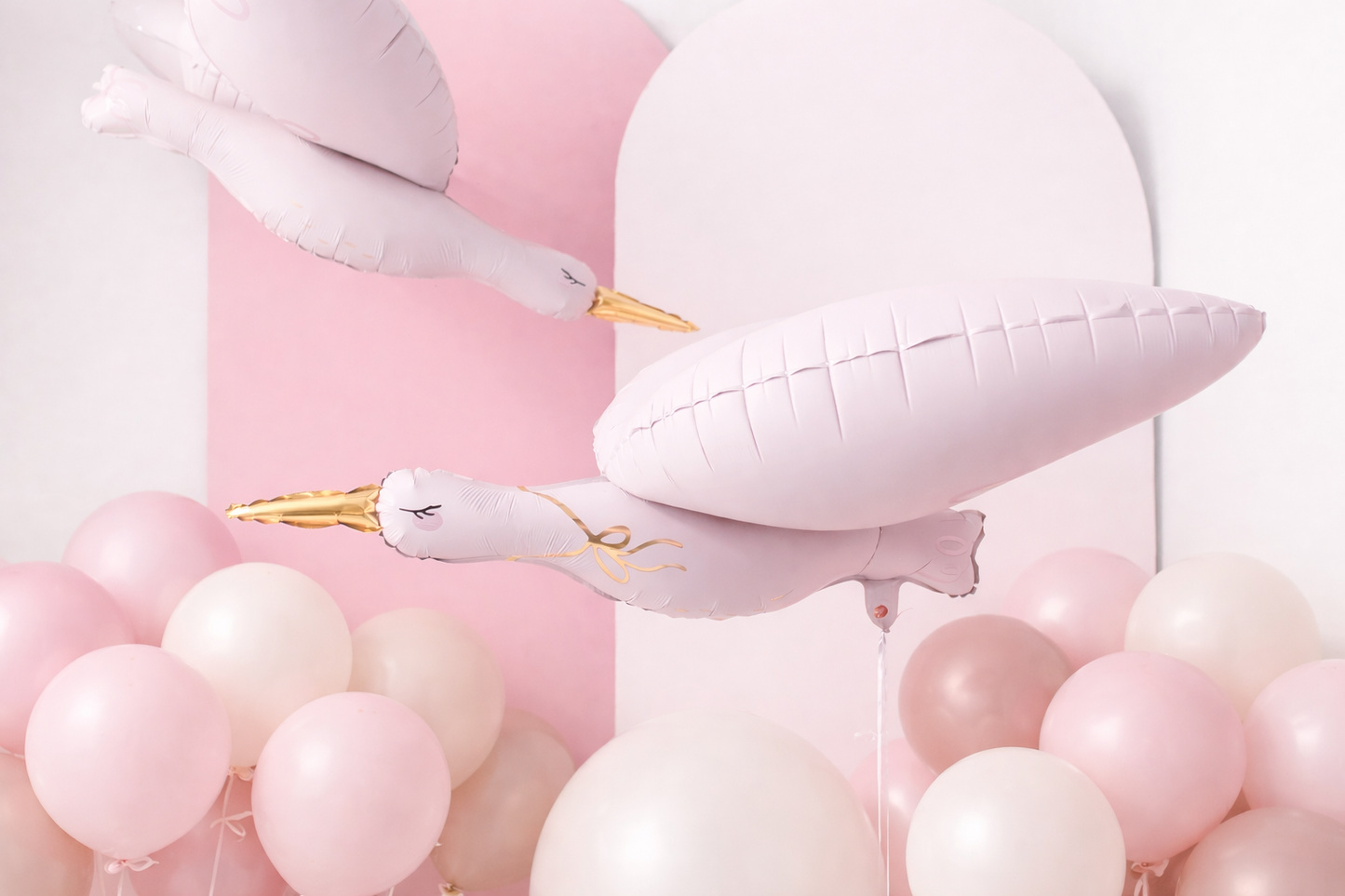 Decorative birthday setup with pink balloons shaped like storks with latex balloons for a birthday in Adelaide.