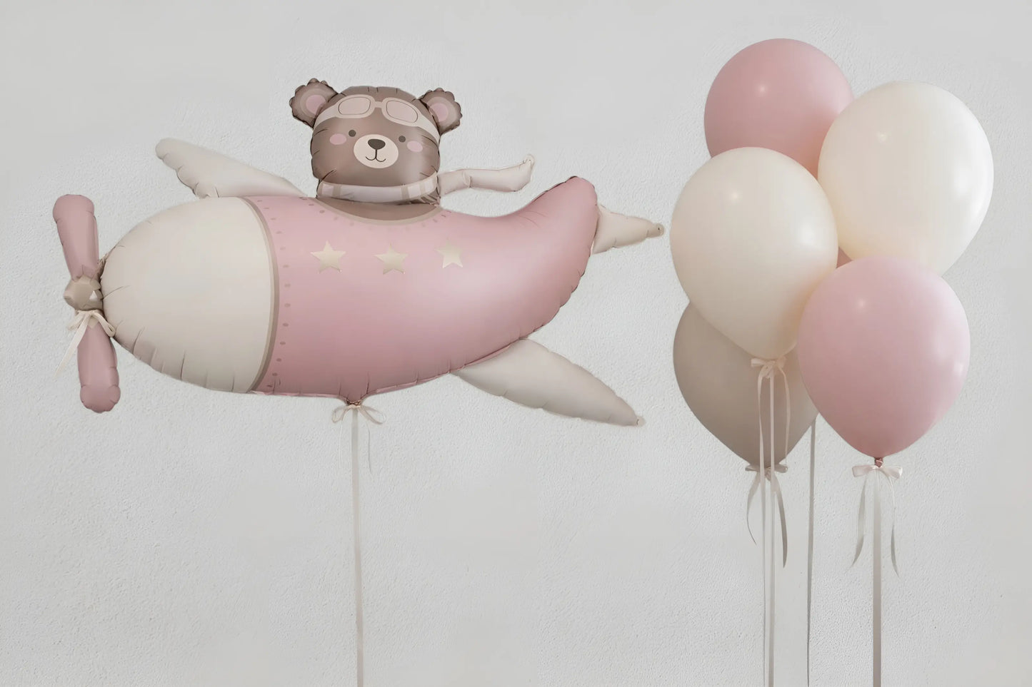 Pink airplane-shaped balloon with a teddy bear and balloons for birthday in Adelaide 