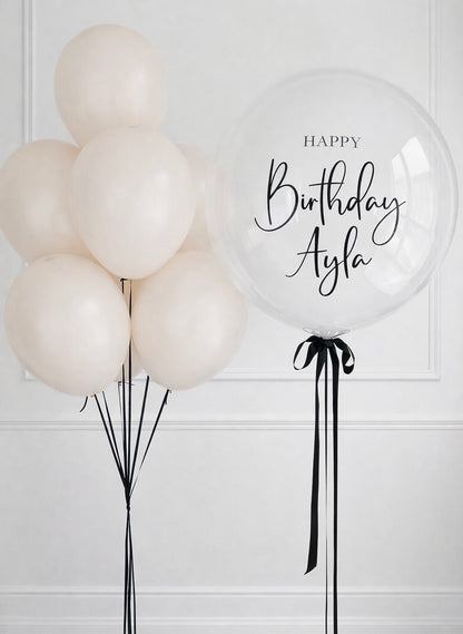 Clear balloons with 'Happy Birthday personalised' text with pink balloons