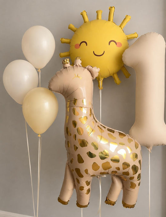 Neutral safari first birthday balloon bouquet featuring a giraffe foil balloon, smiling sun balloon, matte beige number one balloon, and helium-filled latex balloons.