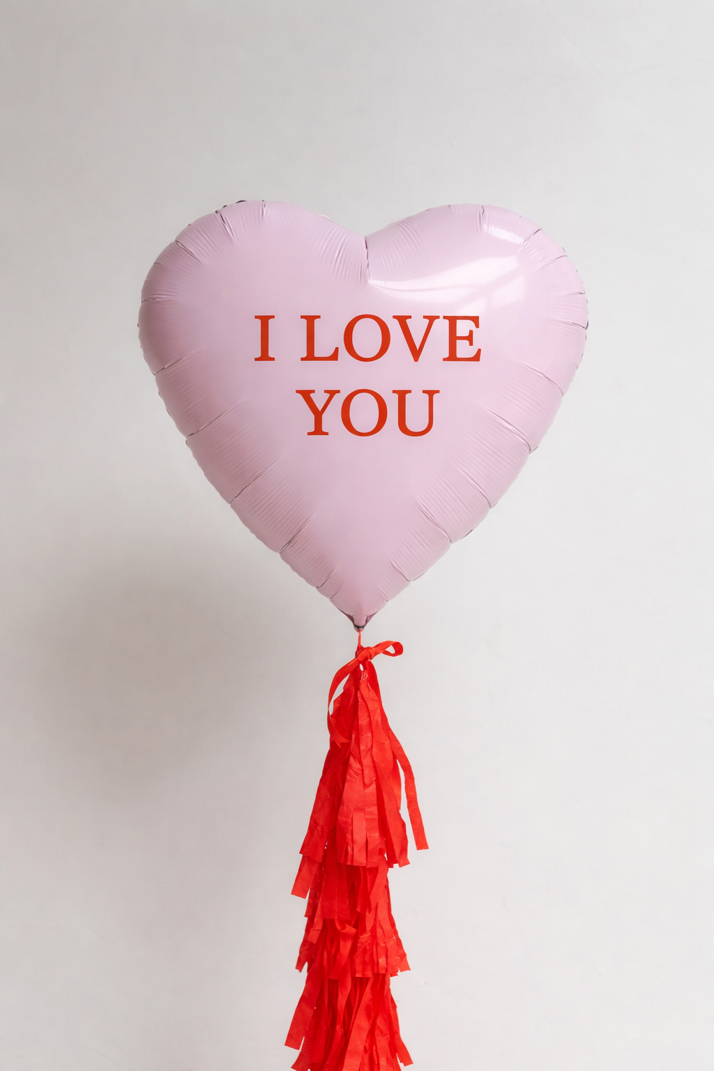 pink Heart-shaped balloon with 'I LOVE YOU' text and red tassels