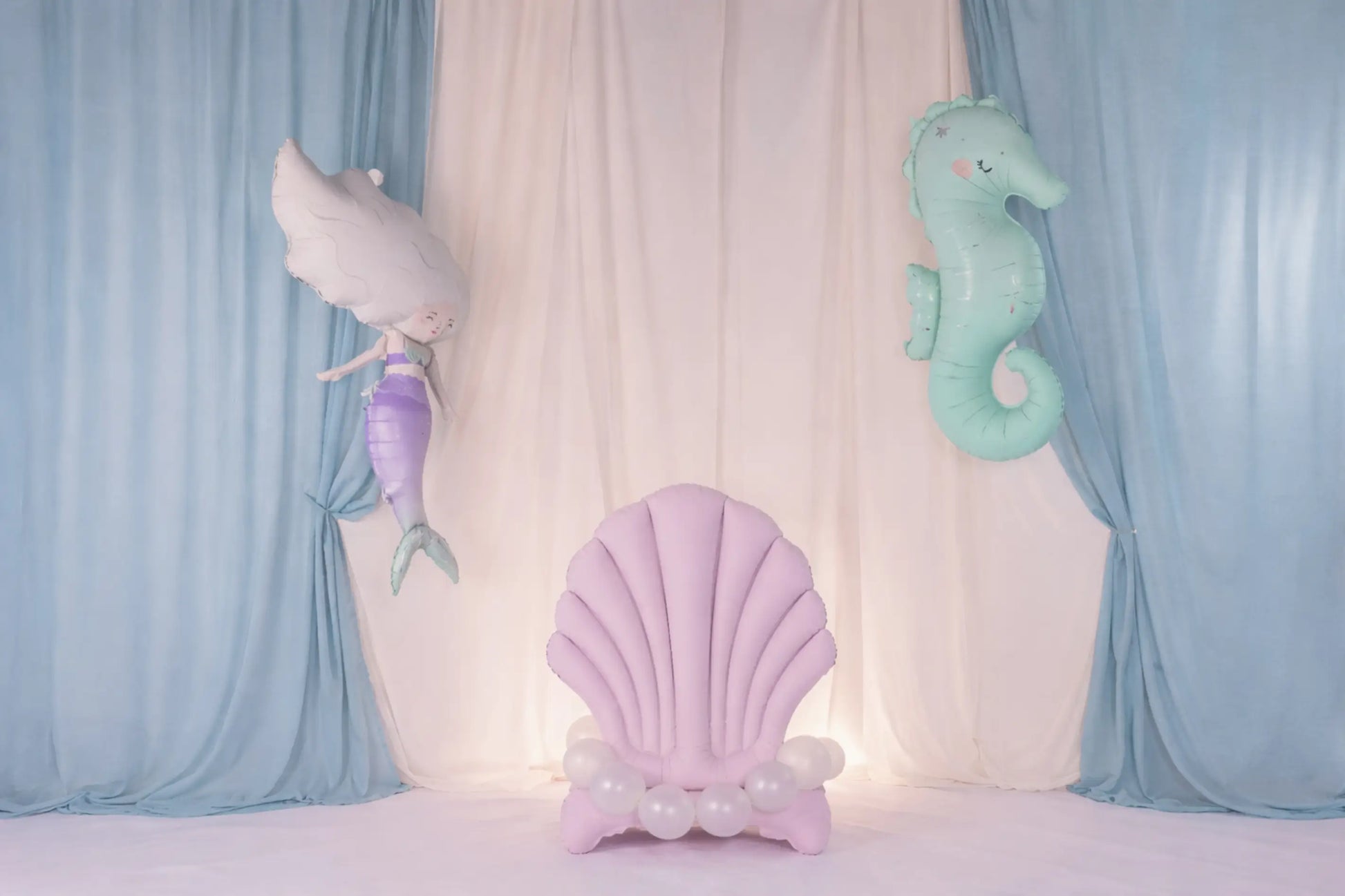 Pastel-colored foil shell with a mermaid and seahorse foil balloons perfect for kids birthdays and other celebrations