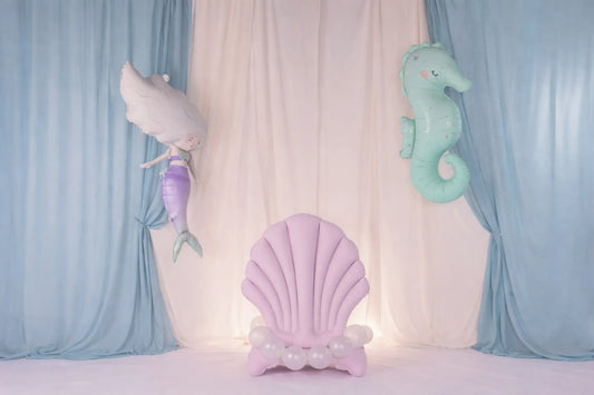 Pastel-colored foil shell with a mermaid and seahorse foil balloons perfect for kids birthdays and other celebrations