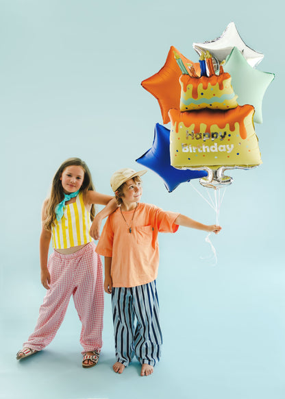The Birthday Bash Edit helium balloon bouquet including a colourful Happy Birthday cake foil balloon surrounded by orange, mint green, silver and royal blue star balloons.