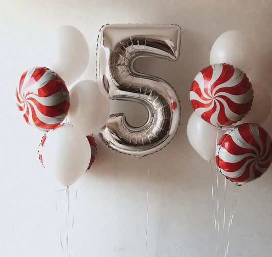 Personalised silver number balloon bouquet with red candy swirl balloons and white latex balloons, delivered inflated in Adelaide.