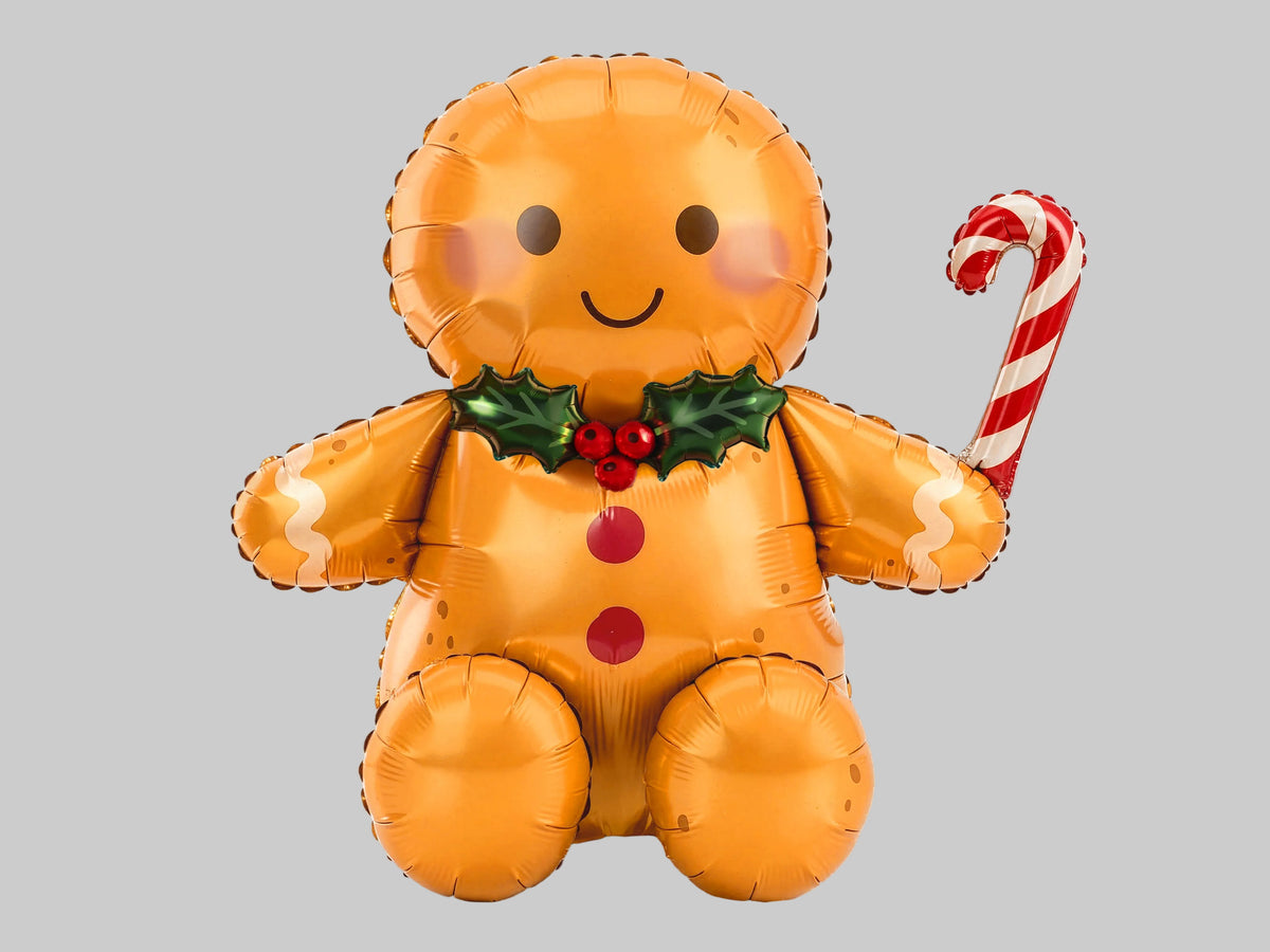 The Christmas Characters Edit gingerbread man foil balloon featuring a cheerful smile, rosy cheeks, festive holly bow and red-and-white candy cane.