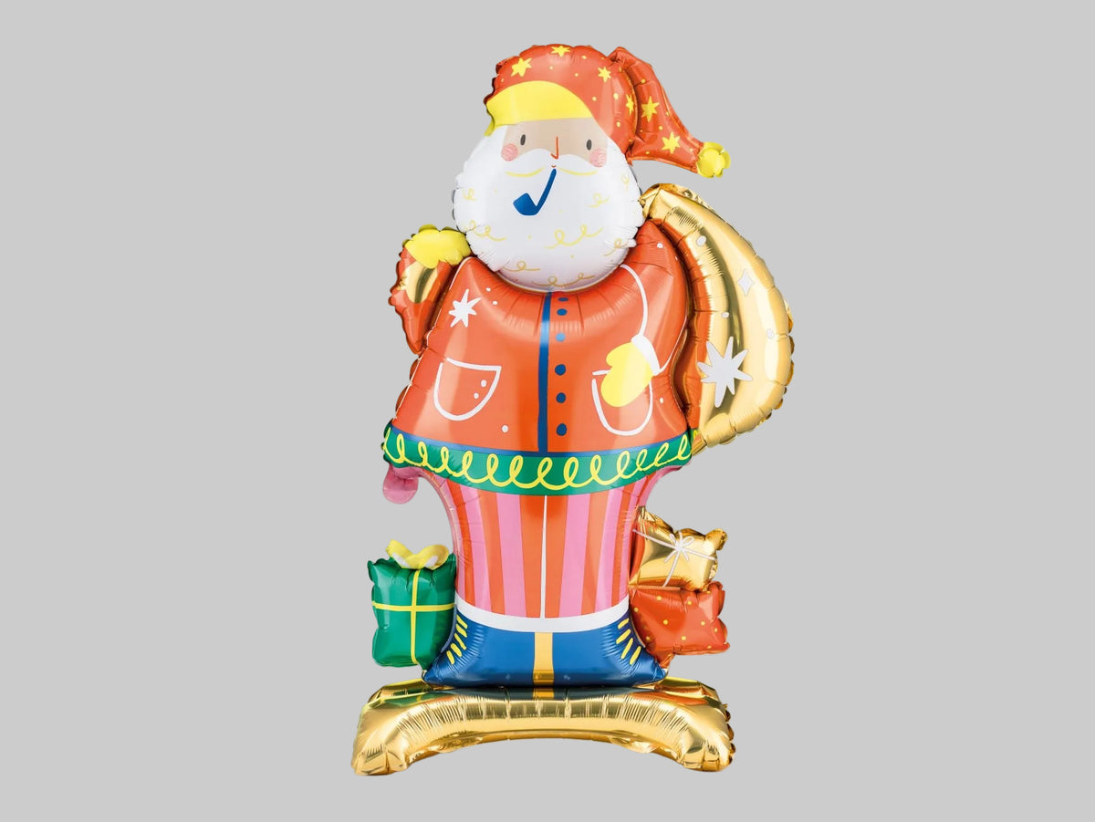 Standing Santa Claus foil balloon featuring an orange coat, white beard, star-patterned hat, metallic gold gift sack and colourful Christmas presents.