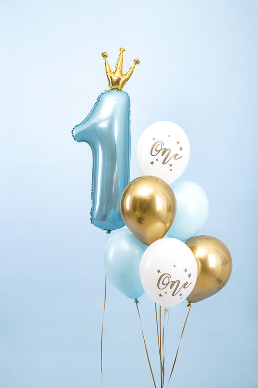 The Little Prince Edit first birthday balloon arrangement featuring a blue number 1 foil balloon with gold crown and coordinating blue, white and gold helium balloons.