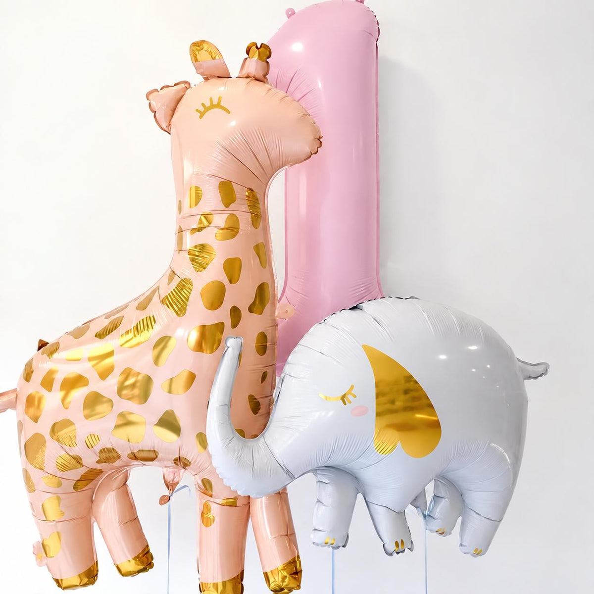 The Little Wild Edit kids birthday balloon arrangement with personalised number, giraffe and elephant balloons