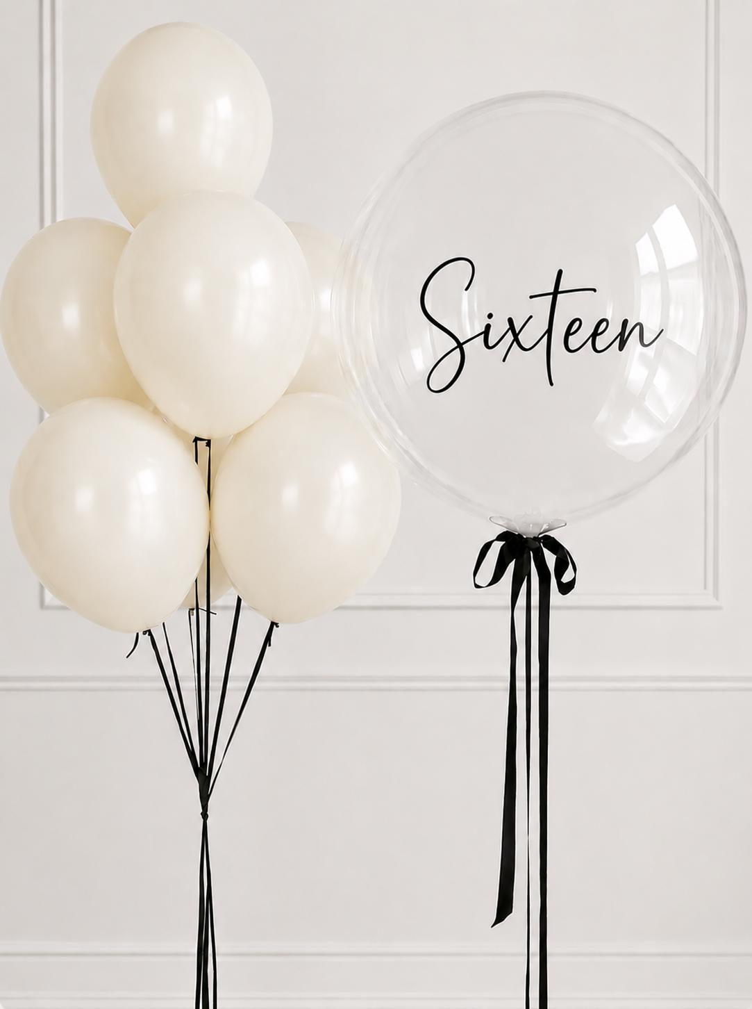 Ivory helium balloon bouquet with personalised clear bubble balloon for a sixteenth birthday.