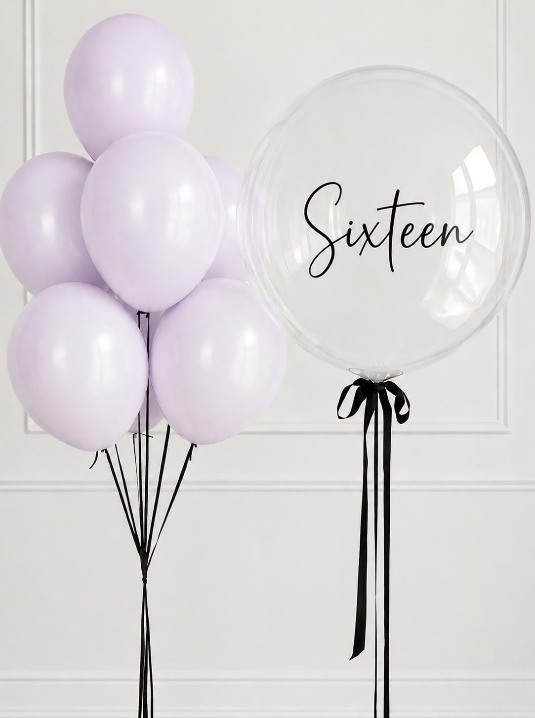 Lilac helium balloon bouquet with personalised clear bubble balloon for a sixteenth birthday.