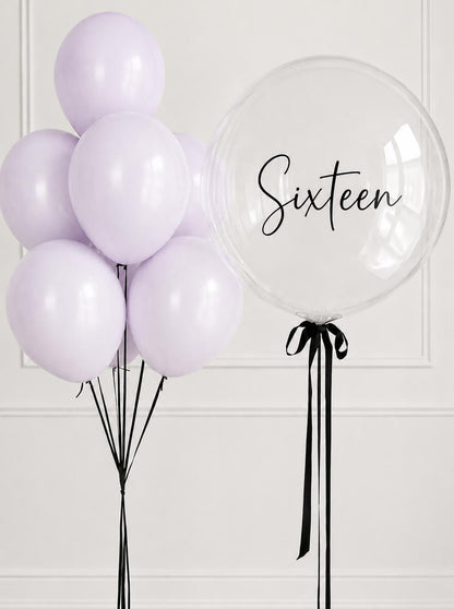 Lilac helium balloon bouquet with personalised clear bubble balloon for a sixteenth birthday.