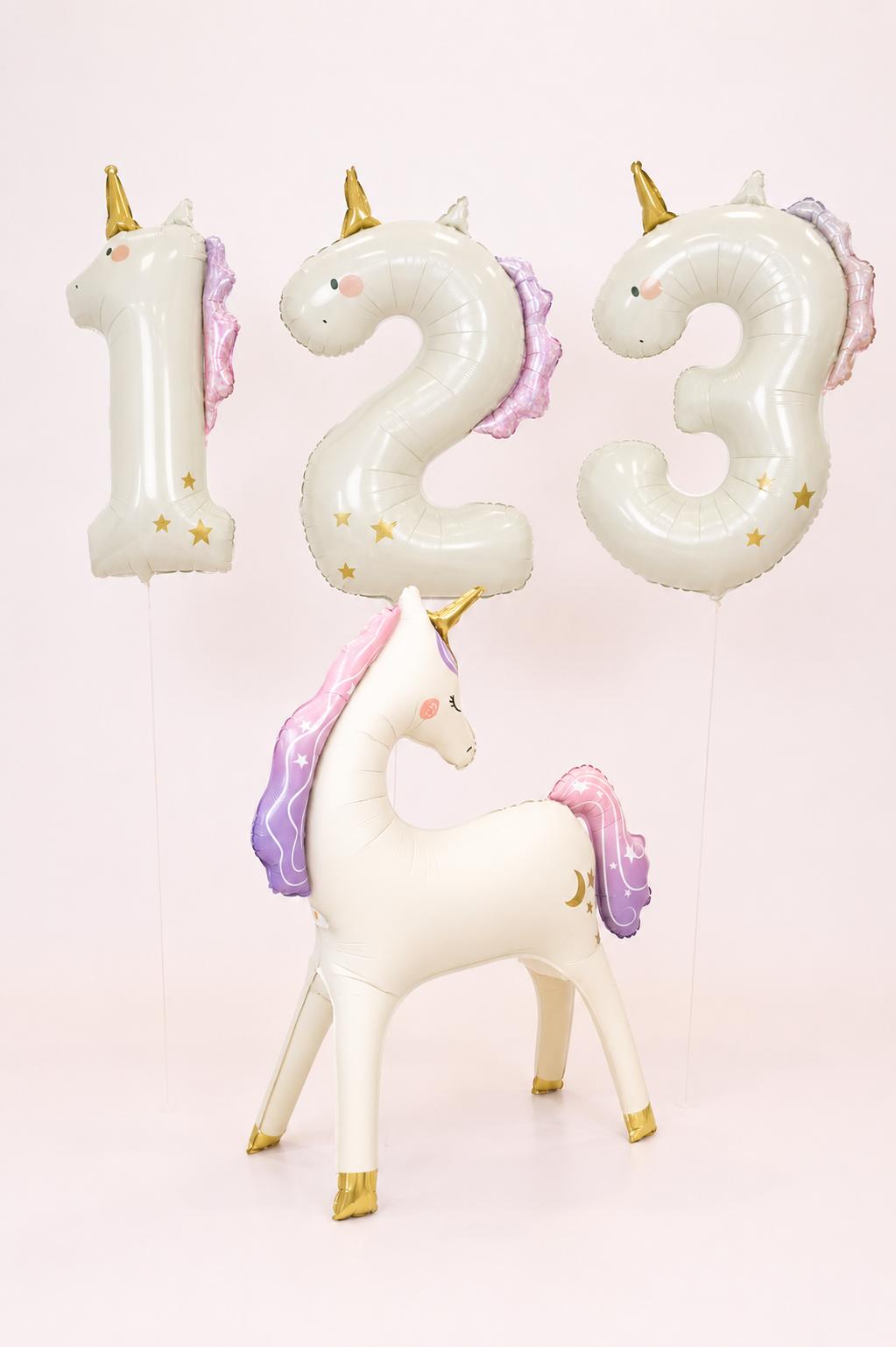 Standing unicorn balloon paired with a choice of number balloon in a magical birthday arrangement.